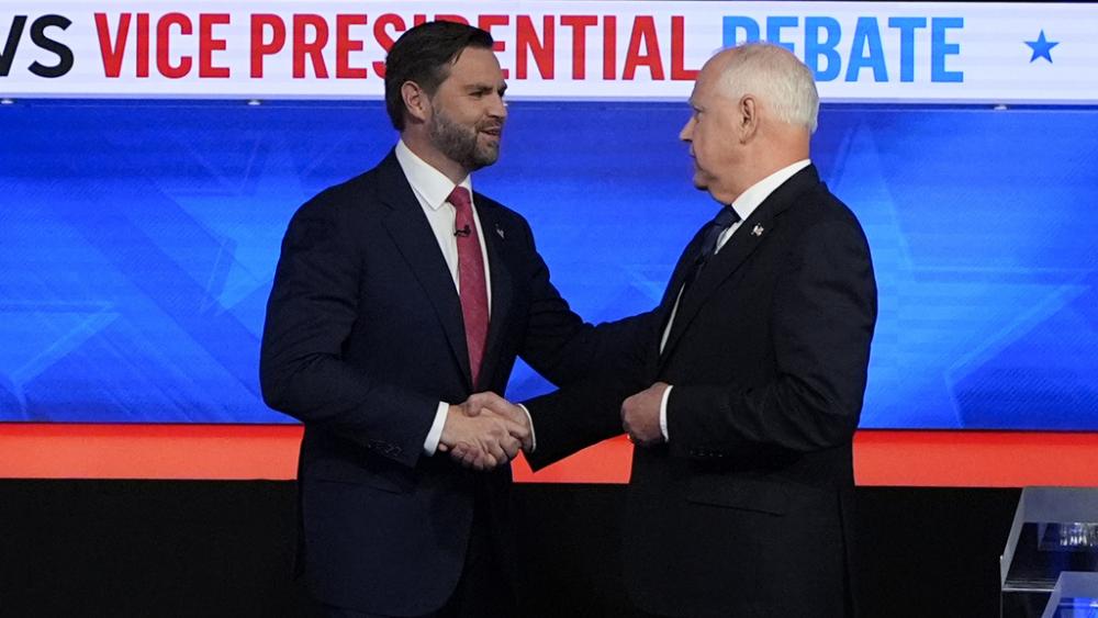 Republican vice presidential nominee Sen. JD Vance, R-Ohio, left, and Democratic vice presidential nominee Minnesota Gov. Tim Walz, meet at the CBS News vice presidential debate, Oct. 1, 2024, in New York. (AP Photo/Julia Demaree Nikhinson)