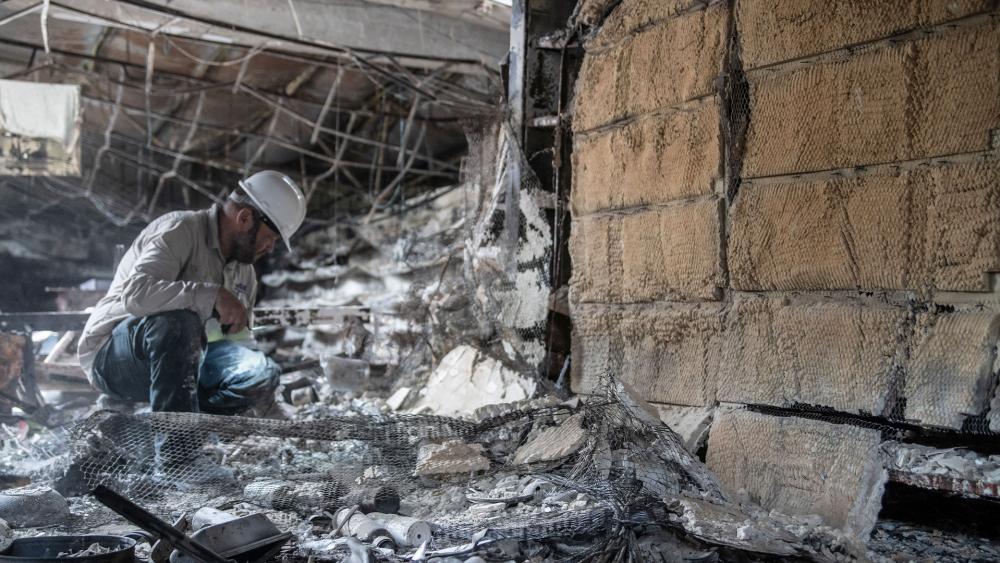 Antiquity archaeogolgists working in forensics to identify missing persons massacred by Hamas on October 7. Photo Credit: Shai Halevi , Israel Antiquities Authority. 