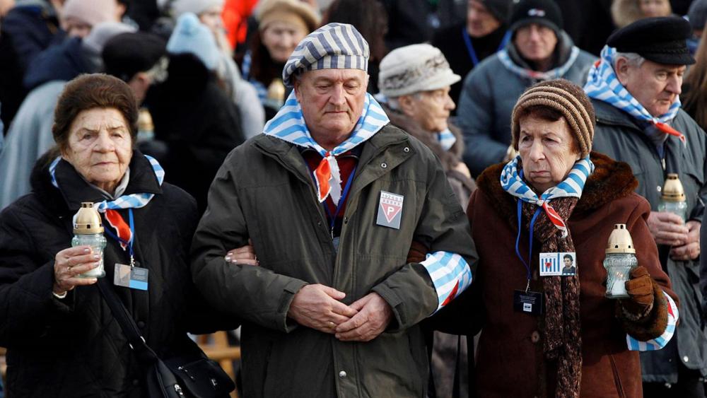 In this Sunday, Jan. 27, 2019 file photo, survivors of the Nazi death camp Auschwitz arrive for a commemoration ceremony on International Holocaust Remembrance Day. AP Photo/Czarek Sokolowski)