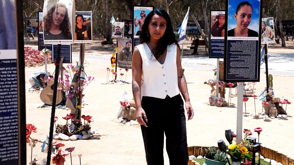 Nova Festival survivor Hadar Sharvit at the memorial site in Re&#039;im, Israel. Photo Credit: CBN News. 