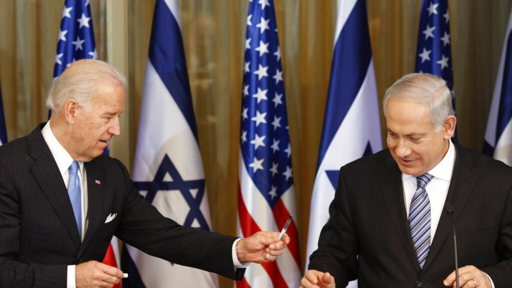 Then-U.S Vice President Joe Biden hands over a pen to Israel&#039;s Prime Minister Benjamin Netanyahu after their meeting at the Prime Minister&#039;s residence in Jerusalem, Tuesday, March 9, 2010.