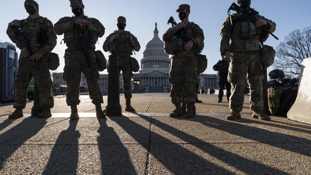 Members of the Michigan National Guard and the U.S. Capitol Police keep watch