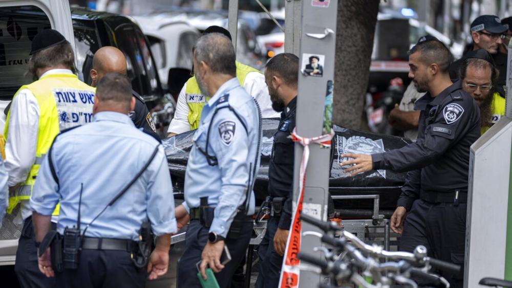 Israeli police remove the body of Palestinian Musa Sarsour after he allegedly killed an 84-year-old Israeli woman and then hung himself, in Tel Aviv, Israel, Wednesday, Sept. 21, 2022. (AP Photo)