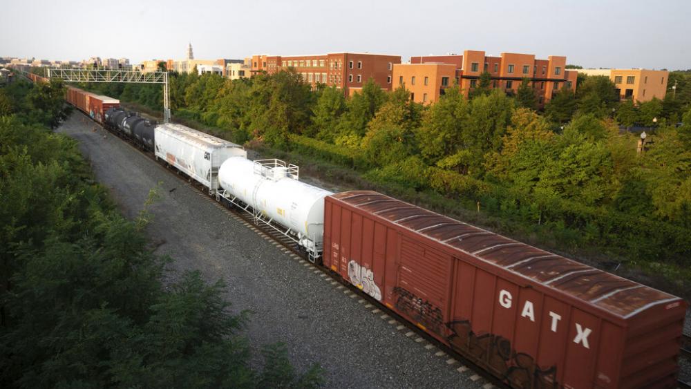 A CSX freight train travels through Alexandria, Va., Sept. 15, 2022. The third largest railroad union rejected its deal with freight railroads Monday, Oct. 10, 2022. (AP Photo/Kevin Wolf, File)