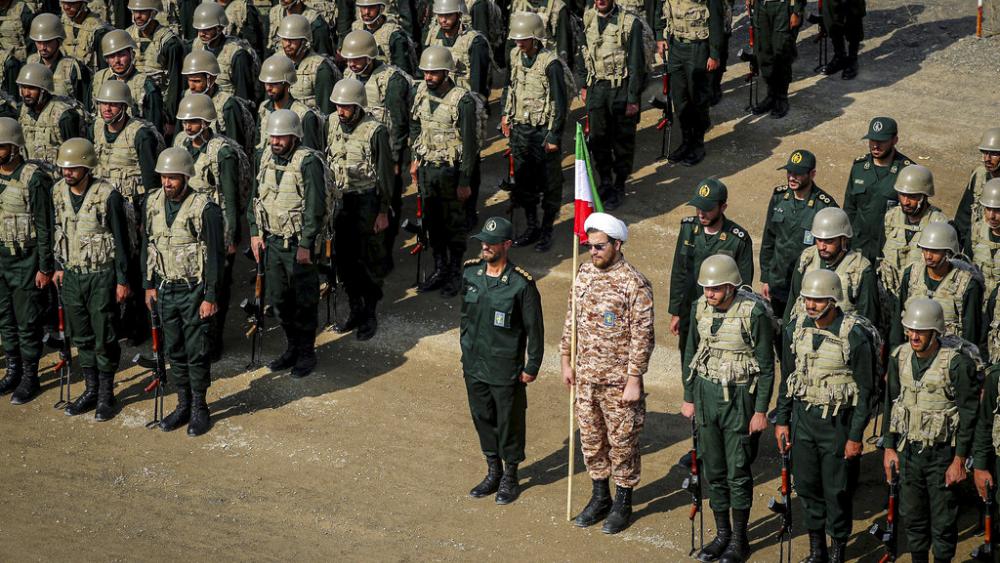 In this photo provided by Revolutionary Guard's ground force on Monday, Oct. 17, 2022, troops stand while attending a maneuver in northwestern Iran. (Iranian Revolutionary Guard's Ground Force via AP)
