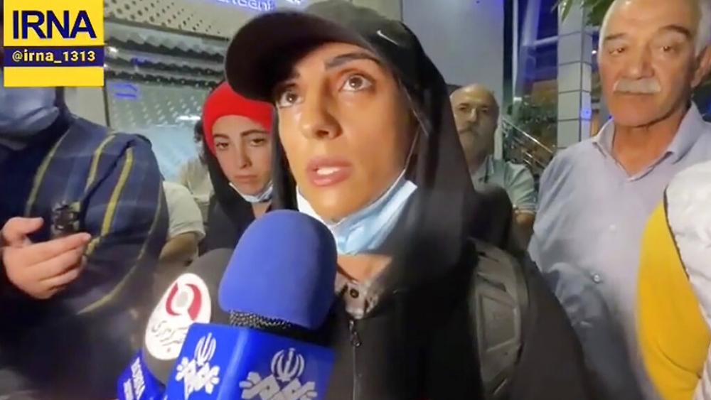 In this image taken from video by Iran&#039;s state-run IRNA news agency, Iranian competitive climber Elnaz Rekabi speaks to journalists in Imam Khomeini International Airport in Tehran, Iran, Wednesday, Oct. 19, 2022.  (IRNA via AP)