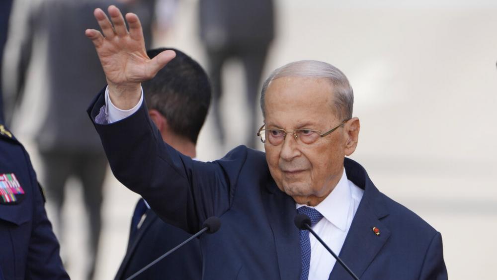Lebanese President Michel Aoun waves for his supporters during a speech to his supporters gathered outside the presidential palace in Baabda, east of Beirut, Lebanon, Sunday, Oct. 30, 2022. (AP Photo/Bilal Hussein)