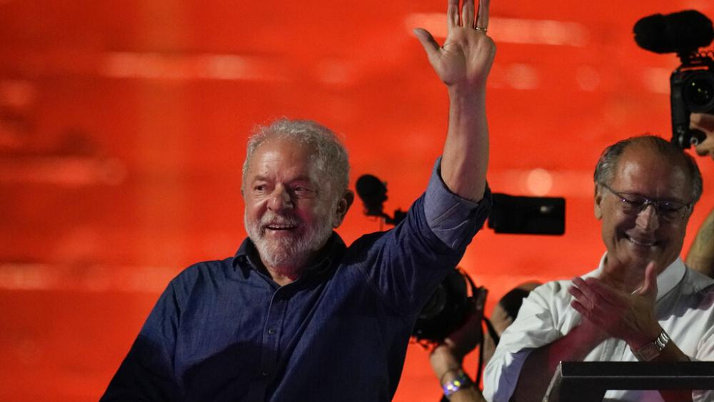 Former Brazilian President Luiz Inacio Lula waves to supporters gathered on Paulista Av. after he defeated incumbent Jair Bolsonaro in a presidential run-off election. (AP Photo/Andre Penner)