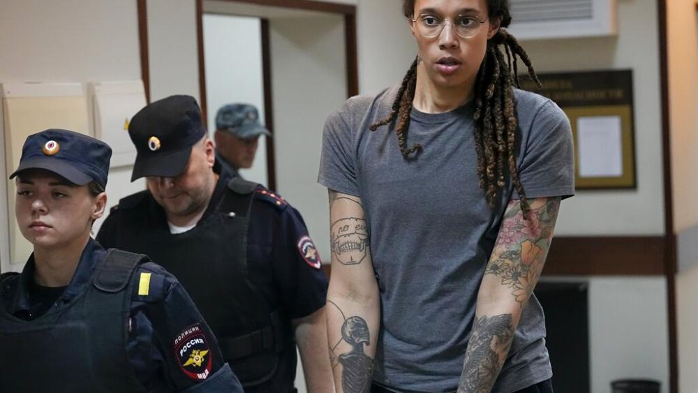 WNBA star and two-time Olympic gold medalist Brittney Griner is escorted from a courtroom after a hearing in Khimki just outside Moscow, Russia, on Aug. 4, 2022. (AP Photo/Alexander Zemlianichenko, File)