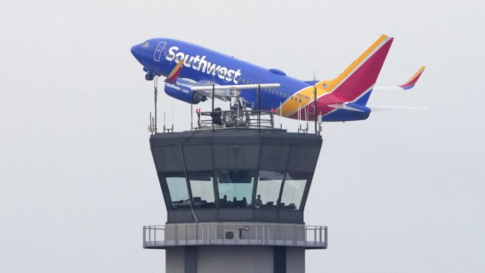 A Southwest Airlines passenger jet takes off from Chicago&#039;s Midway Airport. Flight delays halted air traffic stemming from a computer outage at the FAA Jan. 11, 2023, in Chicago. (AP Photo/Charles Rex Arbogast)