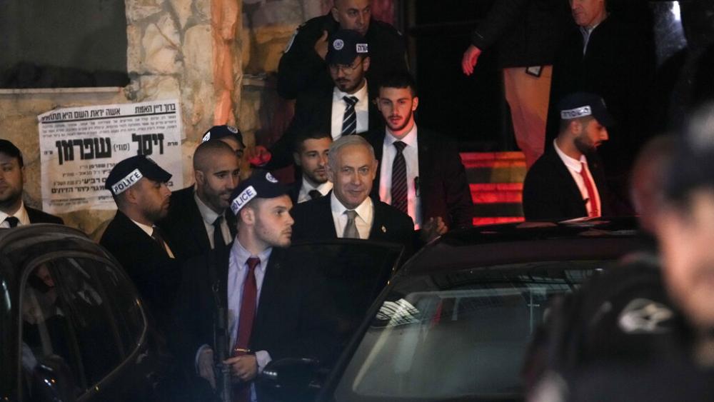 Israeli Prime Minister Benjamin Netanyahu enters his car after visited his ally Aryeh Deri, a Cabinet minister and the head of the ultra-Orthodox Shas party, In Jerusalem, Wednesday, Jan. 18, 2023. (AP Photo/Mahmoud Illean)