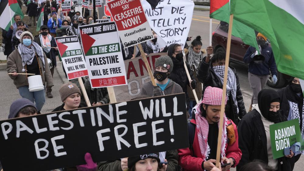 Pro-Palestinian demonstrators march during a visit by President Joe Biden in Warren, Mich., Thursday, Feb. 1, 2024. (AP Photo/Paul Sancya)