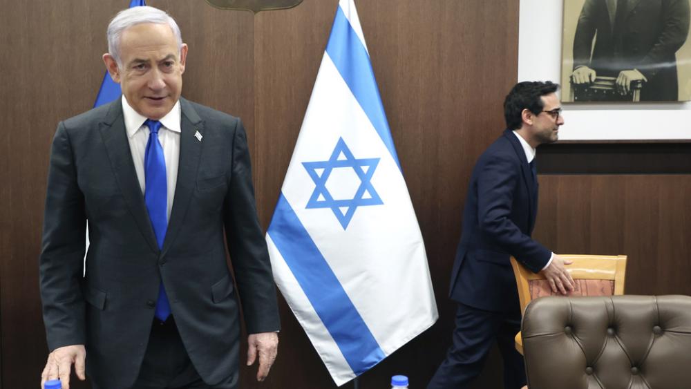 Israeli Prime Minister Benjamin Netanyahu, left, takes a seat before his meeting with France&#039;s Foreign Minister Stephane Sejourne, right, in Jerusalem Monday, Feb. 5, 2024. 5, 2024. (Gil Cohen-Magen/Pool via AP)
