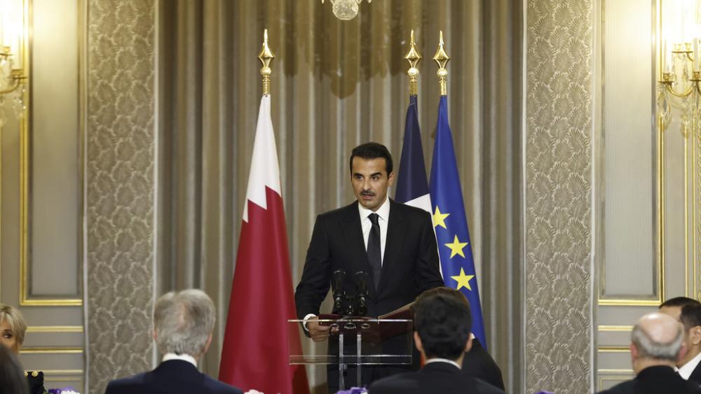 Qatar&#039;s Emir Sheikh Tamim bin Hamad Al Thani delivers a speech during a state dinner with French President Emmanuel Macron at the Elysee Palace in Paris, Tuesday, Feb. 27, 2024. (Yoan Valat, Pool via AP)