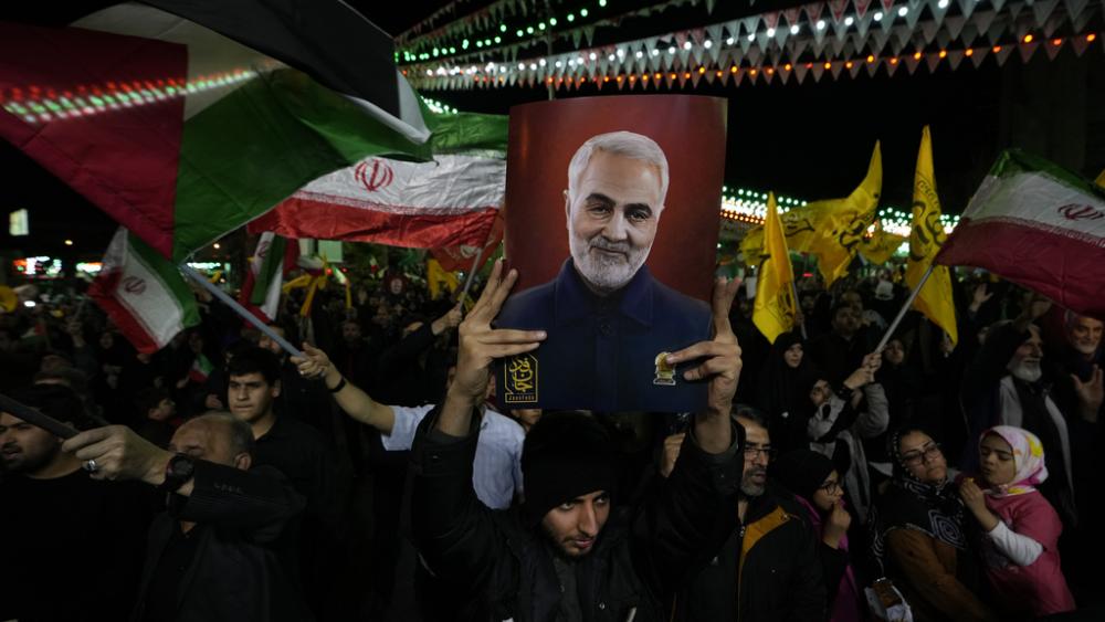 Iranian protesters wave Iranian and Palestinian flags during their anti-Israeli gathering to condemn killing members of the Iranian Revolutionary Guards in Syria,  Monday, April 1, 2024. (AP Photo/Vahid Salemi)