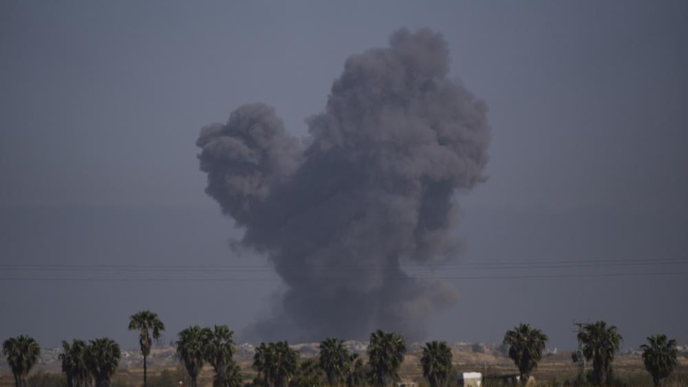 Smoke rises to the sky after an explosion in Gaza Strip, as seen from southern Israel, Thursday, April 4, 2024. (AP Photo/Leo Correa)