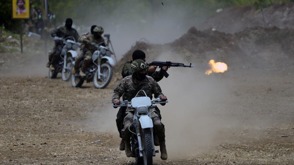 Fighters from the Lebanese militant group Hezbollah carry out a training exercise in Aaramta village in the Jezzine District, southern Lebanon, Sunday, May 21, 2023. (AP Photo/Hassan Ammar, File)