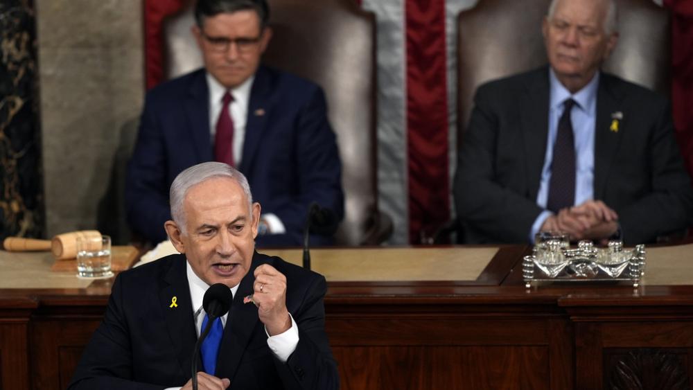 Israeli Prime Minister Benjamin Netanyahu speaks to a joint meeting of Congress in Washington, Wednesday, July 24, 2024, as House Speaker Mike Johnson of La., and Senate Foreign Rel. Chair Ben Cardin, D-Md., listen. (AP Photo/Julia Nikhinson)