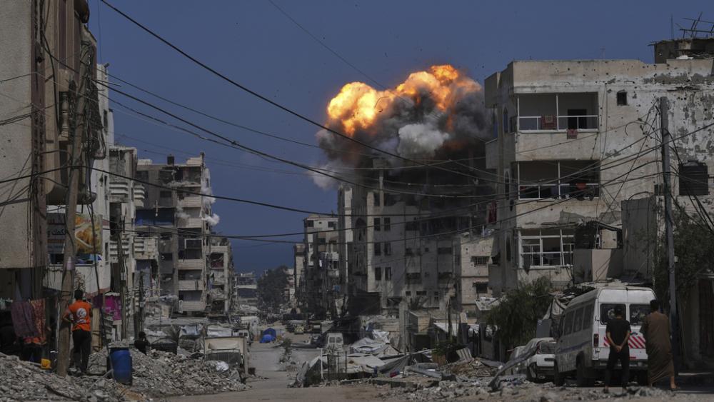 Smoke and flames erupt from an Israeli airstrike in Gaza City, Monday, July 21, 2025. (AP Photo/Jehad Alshrafi)