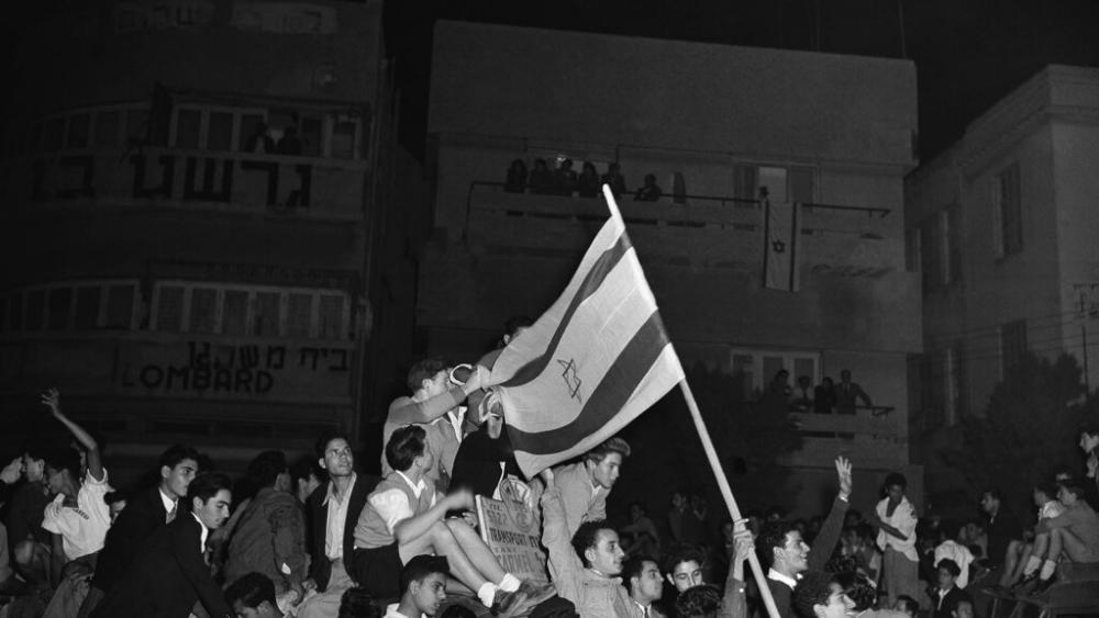 Some of the thousands of Jews celebrate in Tel Aviv as they listen to the broadcast on the United Nations announcement for the plan for partition with the Jewish state on November 30, 1947 in the new Jewish state.