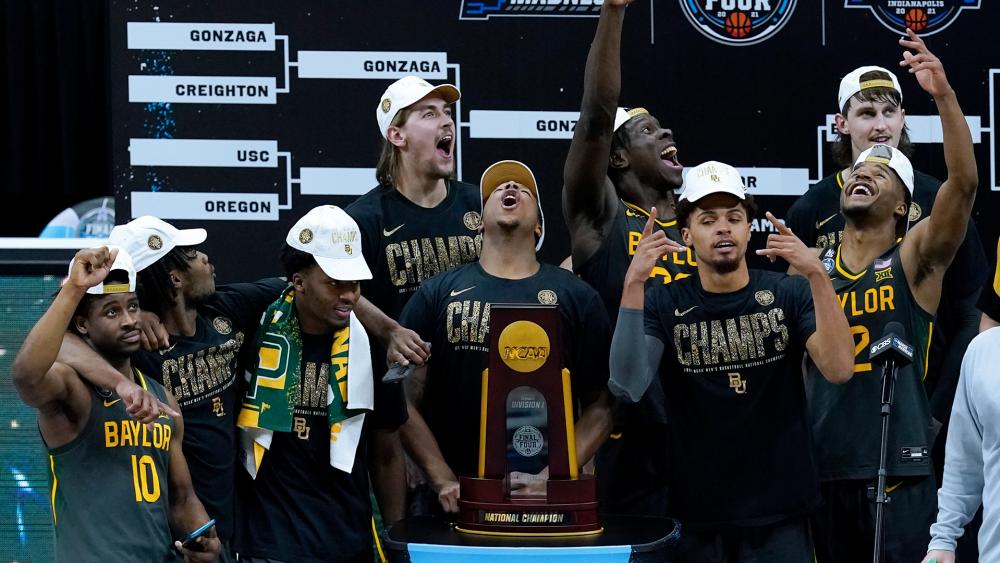 Baylor players celebrate with the trophy after the championship game against Gonzaga in the men&#039;s Final Four NCAA college basketball tournament, Monday, April 5, 2021, at Lucas Oil Stadium in Indianapolis. Baylor won 86-70. (AP Photo/Darron Cummings)
