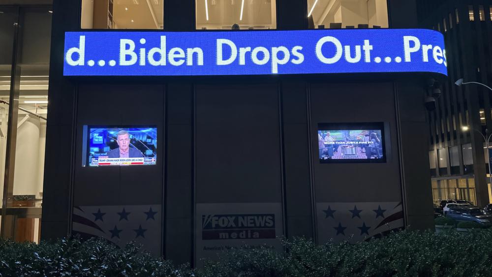 A headline on the news ticker at Fox News headquarters in New York announces &quot;Biden Drops Out&quot; on Sunday, July 21, 2024. (AP Photo/Ted Shaffrey)