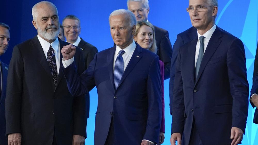 President Joe Biden gestures after a family photo at the NATO Summit, July 10, 2024, in Washington. (AP Photo/Evan Vucci)