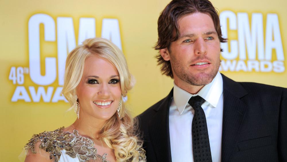 Carrie Underwood and her husband Mike Fisher at the 46th Annual Country Music Awards in 2012, in Nashville, Tenn. (Photo by Chris Pizzello/Invision/AP)