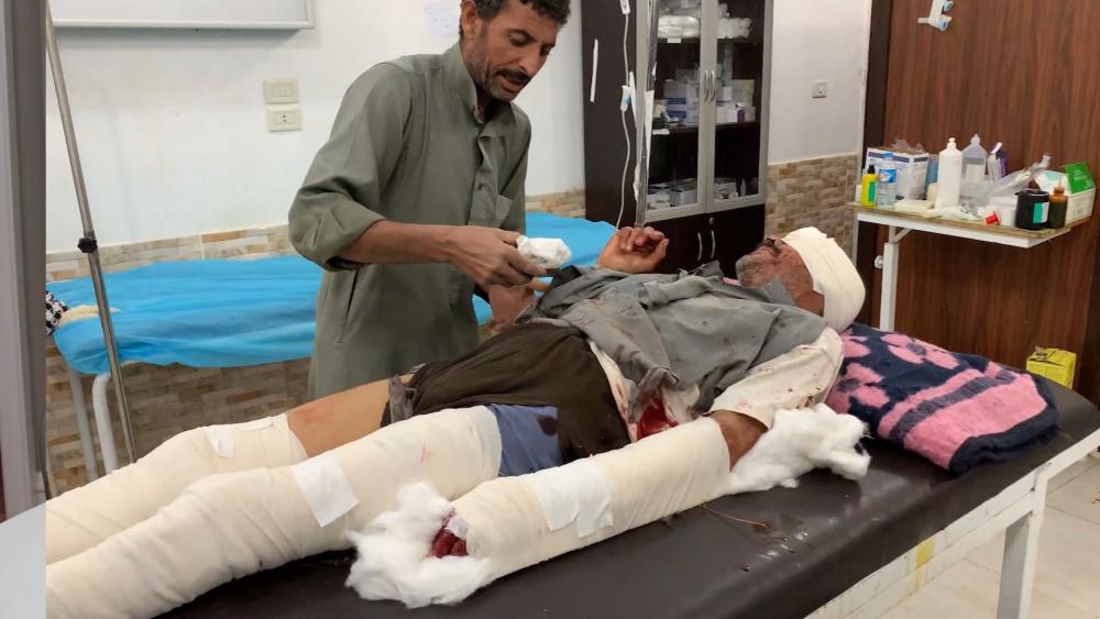 A doctor treats a patient wounded in a Turkish military drone strike in Tal Tamr, Syria. (Image credit: CBN News)