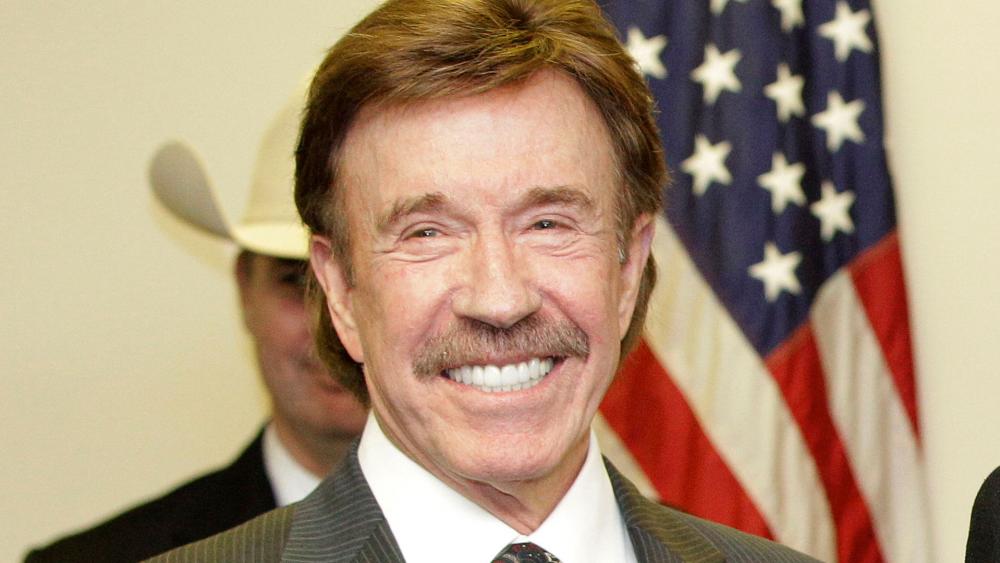 In this Dec. 2, 2010, file photo, actor Chuck Norris stands following a ceremony in Garland, Texas. (AP Photo/Tony Gutierrez, File)