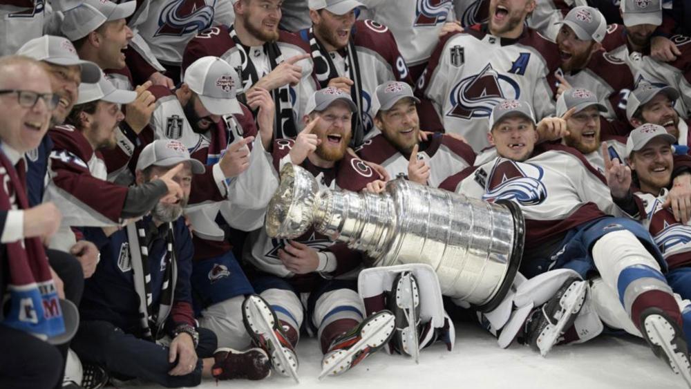The Colorado Avalanche pose with the Stanley Cup after defeating the Tampa Bay Lightning 2-1 in Game 6 of the NHL hockey Stanley Cup Finals on Sunday, June 26, 2022, in Tampa, Fla. (AP Photo/Phelan Ebenhack)