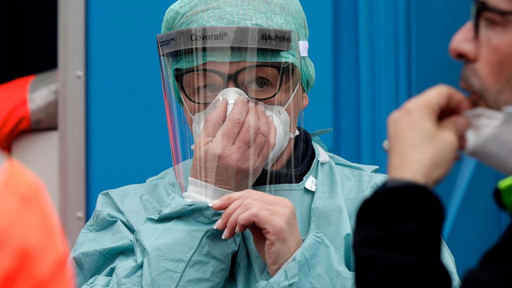 Health care worker fighting coronavirus outbreak in Italy (AP Photo) 