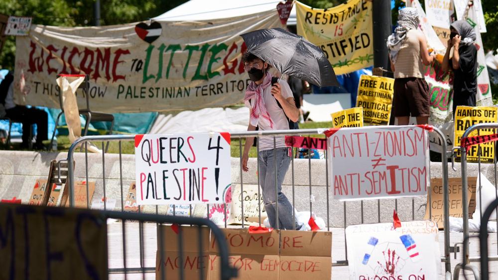 At Columbia University on Wednesday, crowds of masked pro-Palestinian protesters stormed the library, beating drums and chanting.