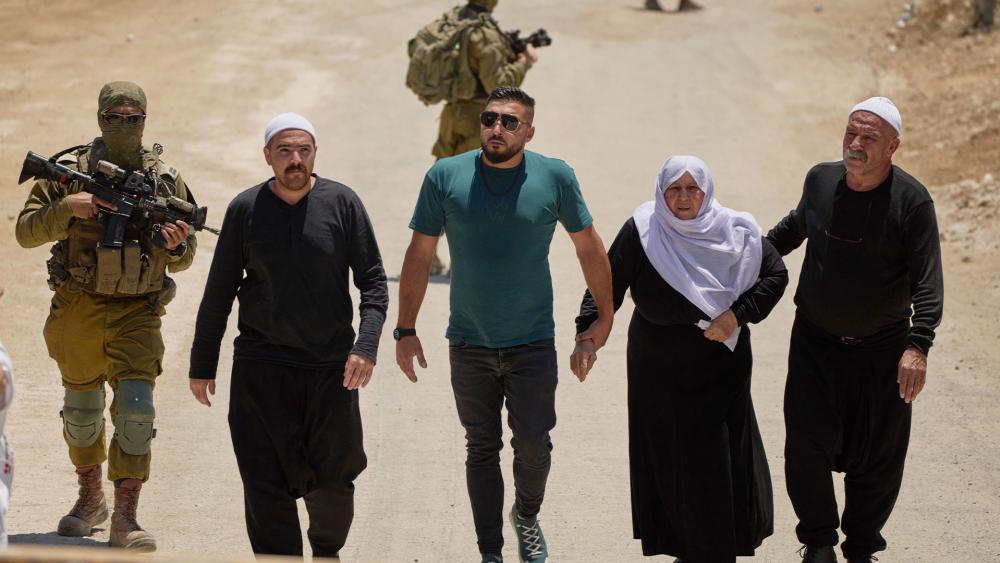 Syrian Druze cross back into Syria near the Israeli-Syrian border in Majdal Shams, Golan Heights, July 17, 2025. Photo Credit: AP Photo/Leo Correa