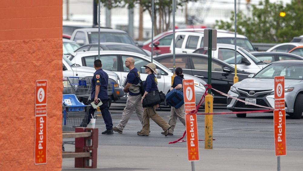 FBI agents arrive at the Walmart store in the aftermath of a mass shooting in El Paso, Texas, Sunday, Aug. 4, 2019 (AP Photo/Andres Leighton)