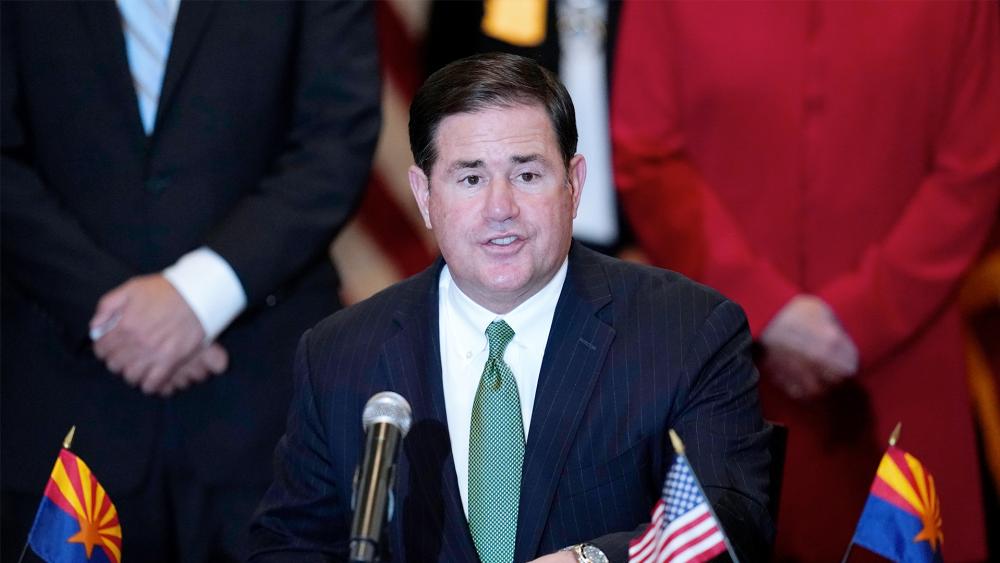 Arizona Republican Gov. Doug Ducey speaks during a bill signing in Phoenix (AP Photo/Ross D. Franklin, File)