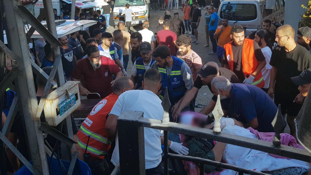 Civil Defense first-responders carry a man who was wounded after his handheld pager exploded, in the southern port city of Sidon, Lebanon, Tuesday, Sept. 17, 2024.(AP Photo)