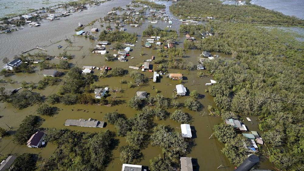 Homes are flooded in the aftermath of Hurricane Ida, Monday, Aug. 30, 2021, in Lafitte, La. The weather died down shortly before dawn. (AP Photo/David J. Phillip)
