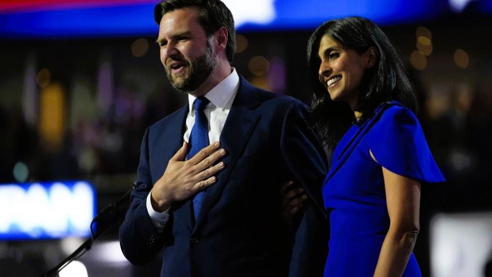 Vice Presidential Nominee Sen. JD Vance and wife Usha Chilukuri Vance acknowledge the crowd during the Republican National Convention Wednesday, July 17, 2024, in Milwaukee. (AP Photo/Paul Sancya)