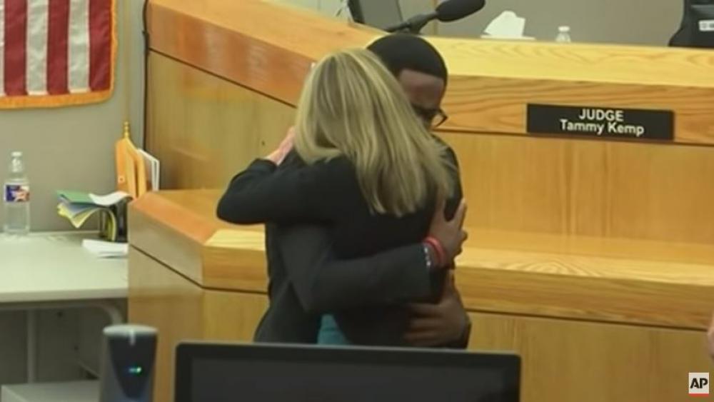 Botham Jean&#039;s brother Brandt embraces former Dallas Police officer Amber Guyger who was sentenced to 10 years for killing his brother. (Screenshot credit: AP) 