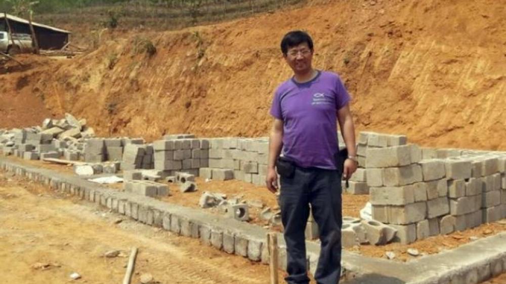 Rev. John Sanqiang Cao breaks a ground on a new school in Wa State, Myanmar. The prominent Chinese pastor who has been detained by Chinese authorities since March 5, 2017 was sentenced in March 2018 to seven years in prison. 