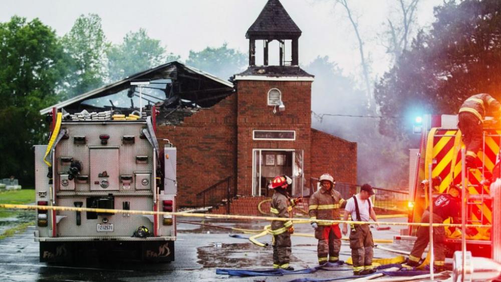 Firefighters and fire investigators respond to a fire at Mt. Pleasant Baptist Church Thursday, April 4, 2019, in Opelousas, La. (Leslie Westbrook/The Advocate via AP)