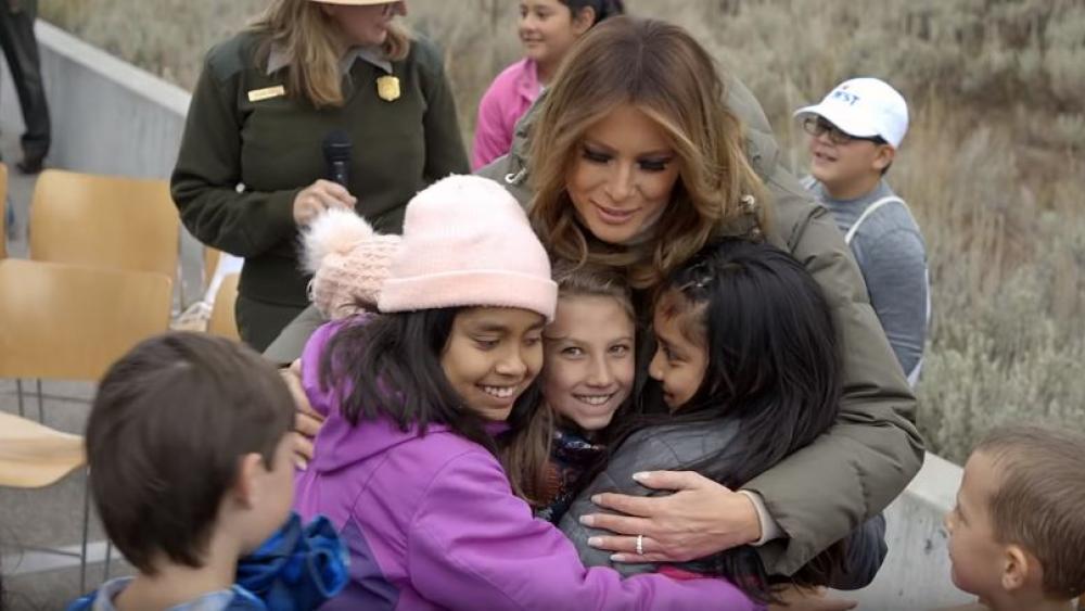 First Lady Melania Trump joins in a group hug with children at the Grand Teton National Park. (Screenshot credit: White House/Youtube)