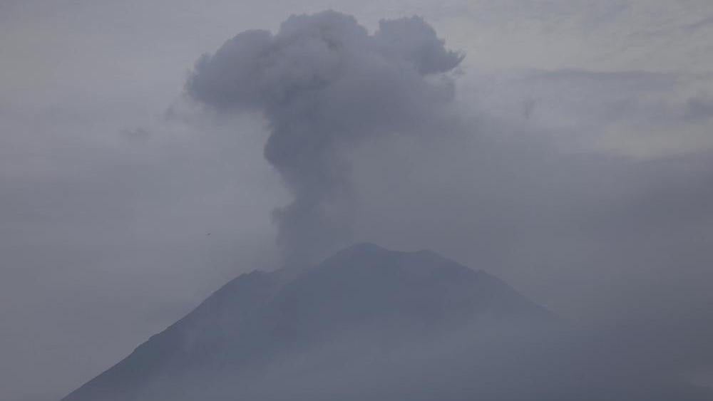 Mount Semeru releases volcanic materials during an eruption as seen from Lumajang, East Java, Indonesia, Sunday, Dec. 5, 2021.  (AP Photo/Trisnadi)