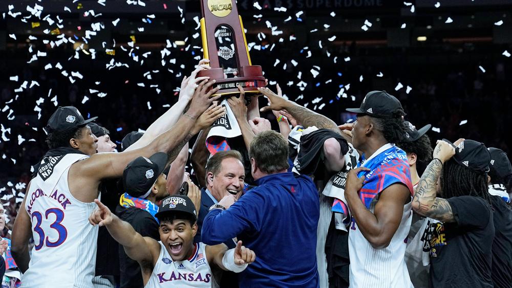 Kansas celebrates after their win against North Carolina in the college basketball finals at the NCAA tournament, April 4, 2022, in New Orleans. (AP Photo/David J. Phillip)
