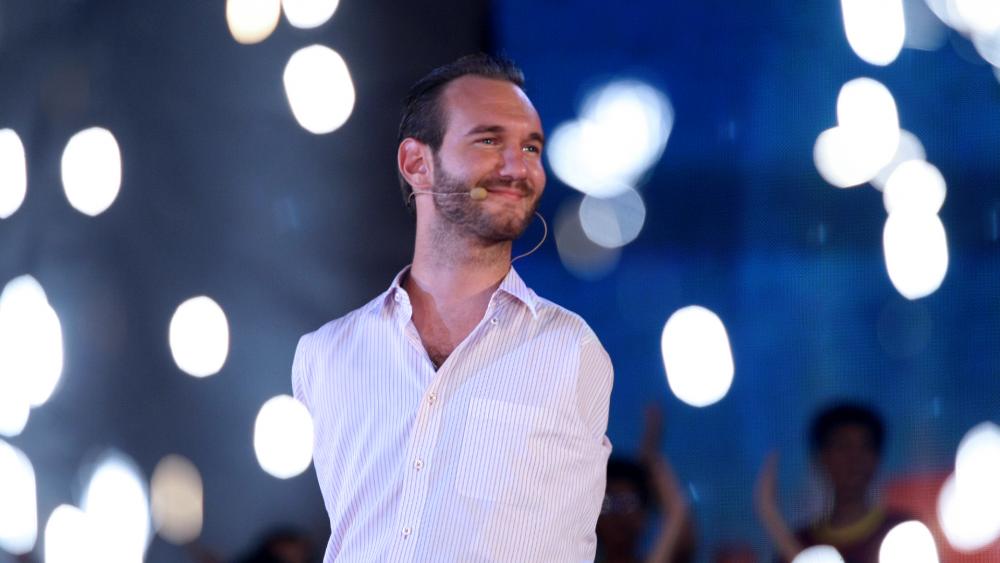 Nick Vujicic, a Christian evangelist who was born with no limbs, greets a crowd of 25,000 young people at My Dinh national stadium in Hanoi, Vietnam. (AP Photo/Na Son Nguyen)