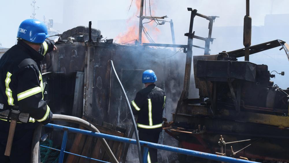 Firefighters put out a fire in a port after a Russian missiles attack in Odesa, Ukraine. (Odesa City Hall Press Office via AP)