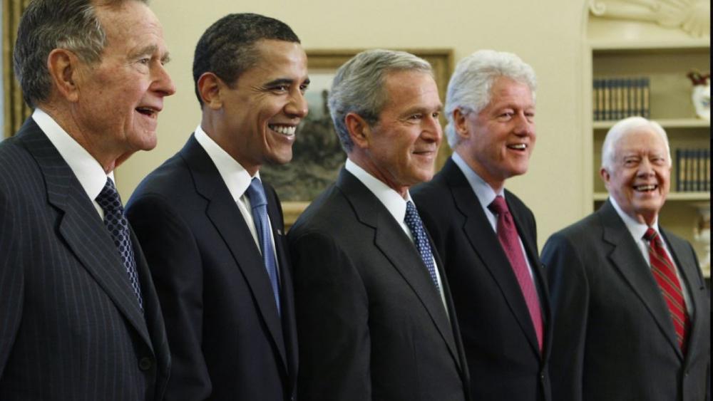 In this Jan. 7, 2009, file photo, President George W. Bush, center, poses with President-elect Barack Obama, second left, and former presidents, George H.W. Bush, left, Bill Clinton, second right, and Jimmy Carter, right. AP photo.