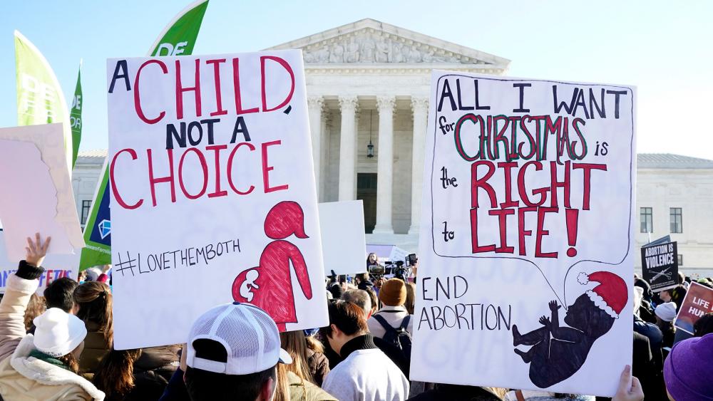 Supreme court hears arguments in a case from Mississippi, where a 2018 law would ban abortions after 15 weeks of pregnancy (AP Photo/Jacquelyn Martin)