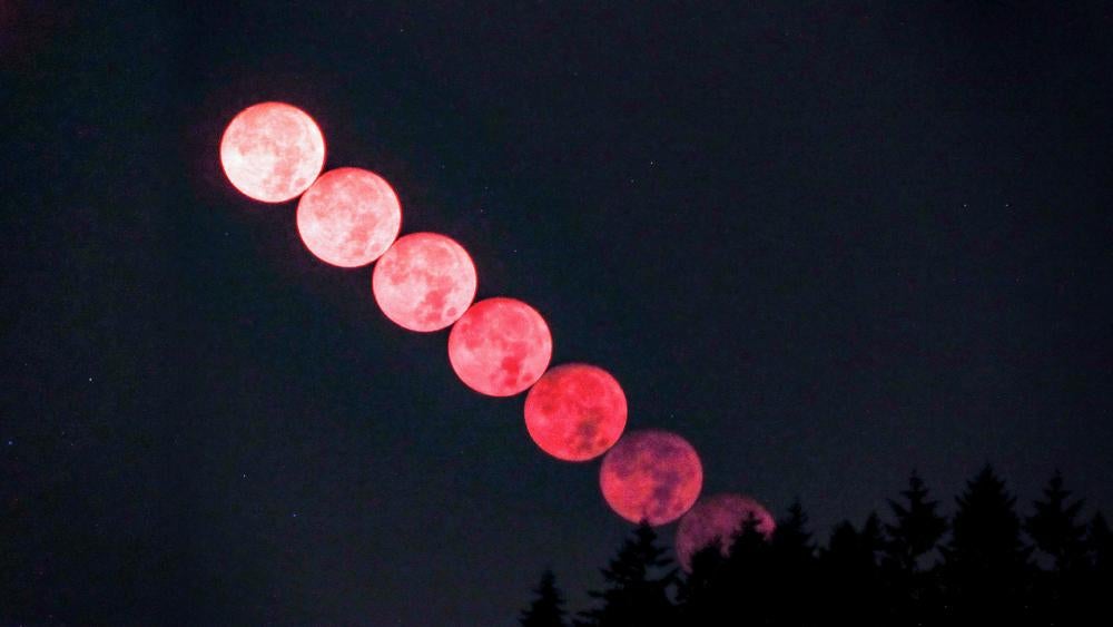 The moon turns red over Seattle, thanks to wildfires and smoke. (Photo courtesy: National Weather Service Seattle via Twitter)